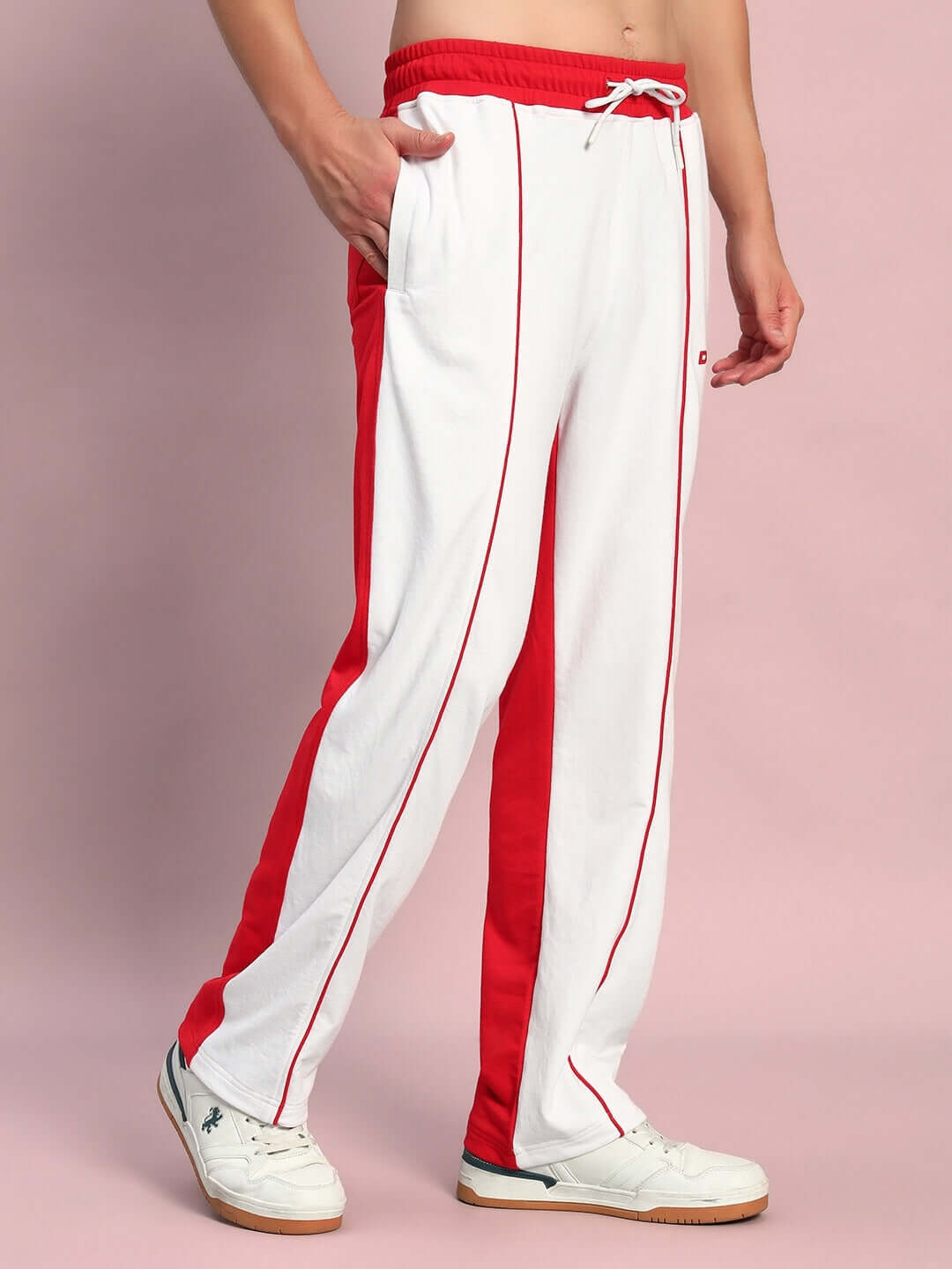 Man wearing Lagoon Relaxed Fit Joggers in white with red stripes, made by DUDS. Ideal for casual wear and customizable in size.