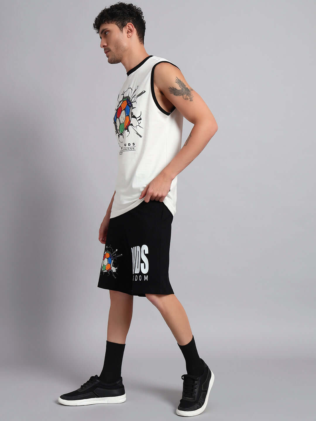 Man wearing LAZIO CO-ORD SET OFF-WHITE BLACK, featuring a premium heavy gauge fabric with a stylish design.