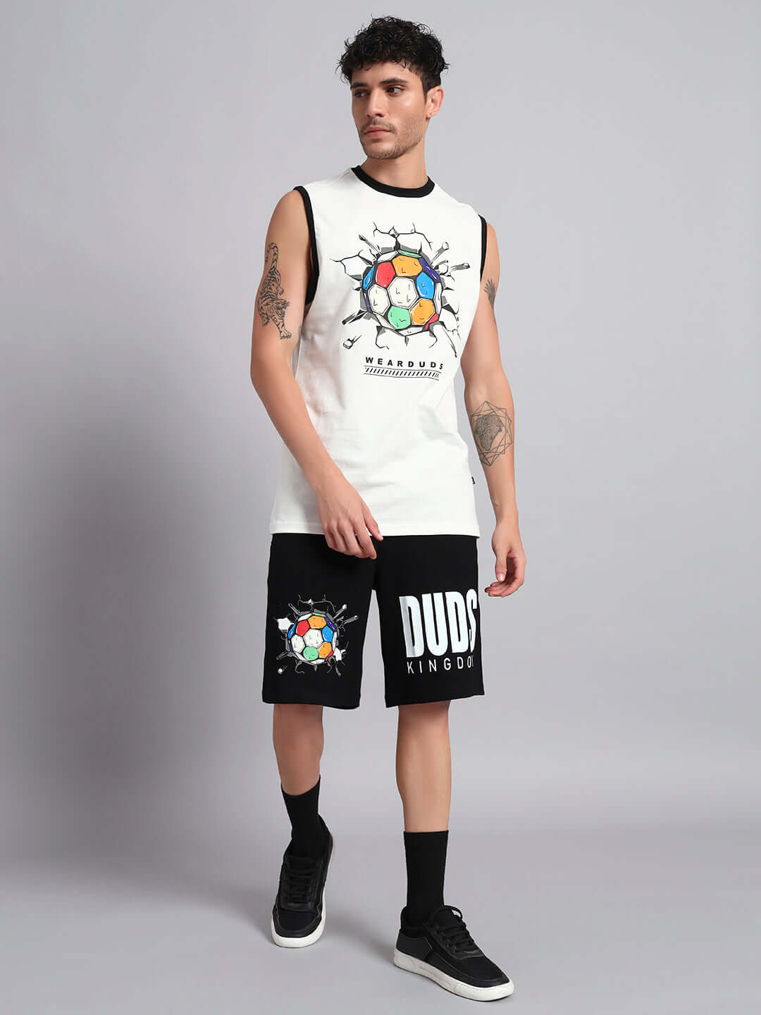 Man wearing LAZIO CO-ORD SET OFF-WHITE BLACK premium heavy gauge fabric with unique design.