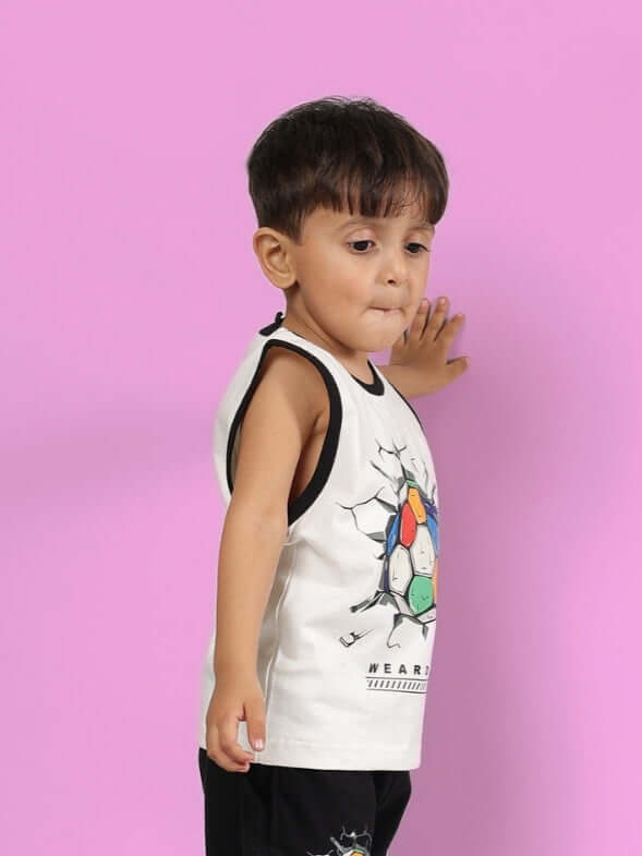 Young child wearing an off-white LAZIO t-shirt against a pink background, featuring a colorful graphic design.