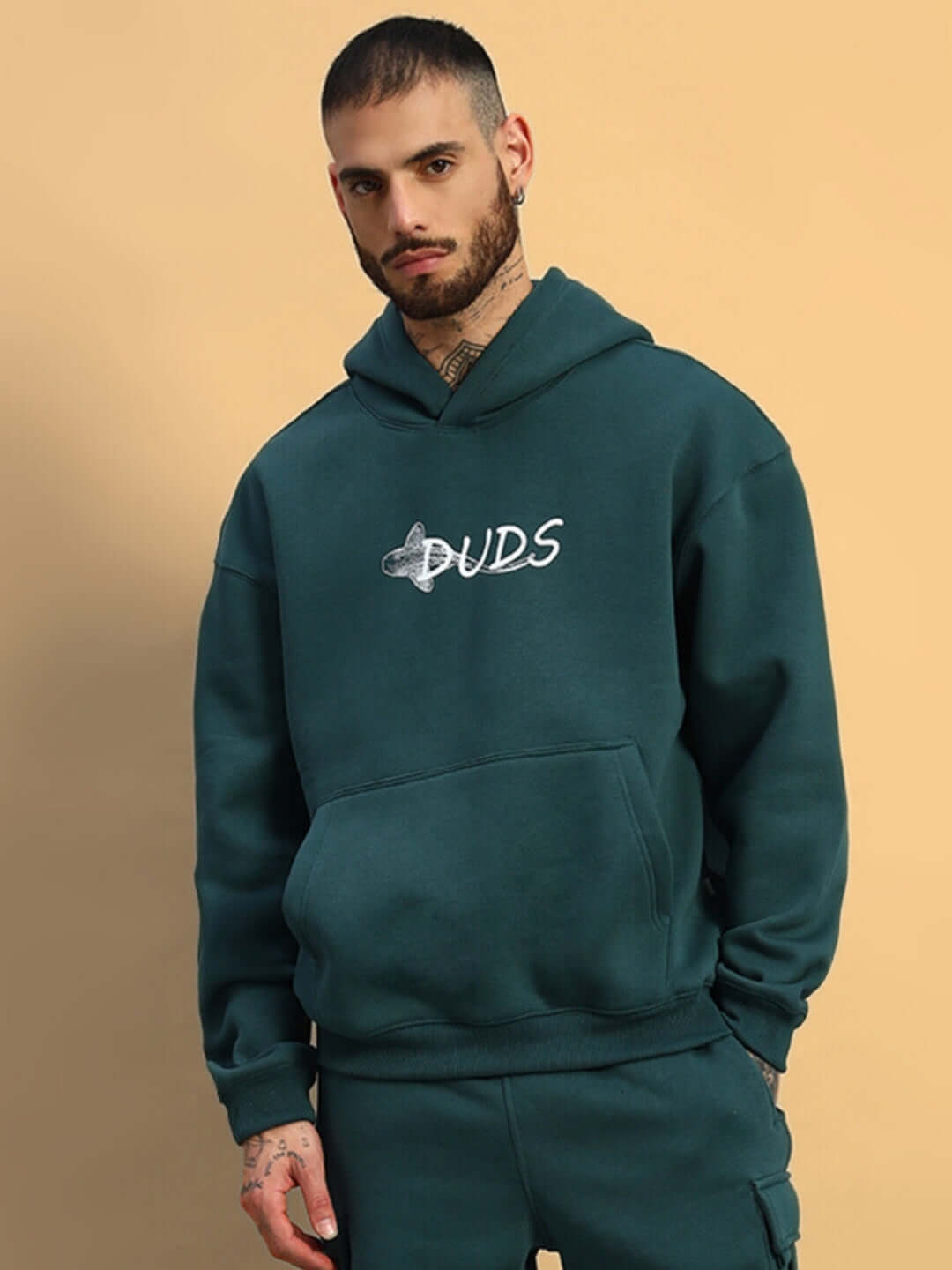 Man wearing LEOPARD SHARK FLEECE HOODIE TEAL GREEN from DUDS collection, made to order with custom fit options.