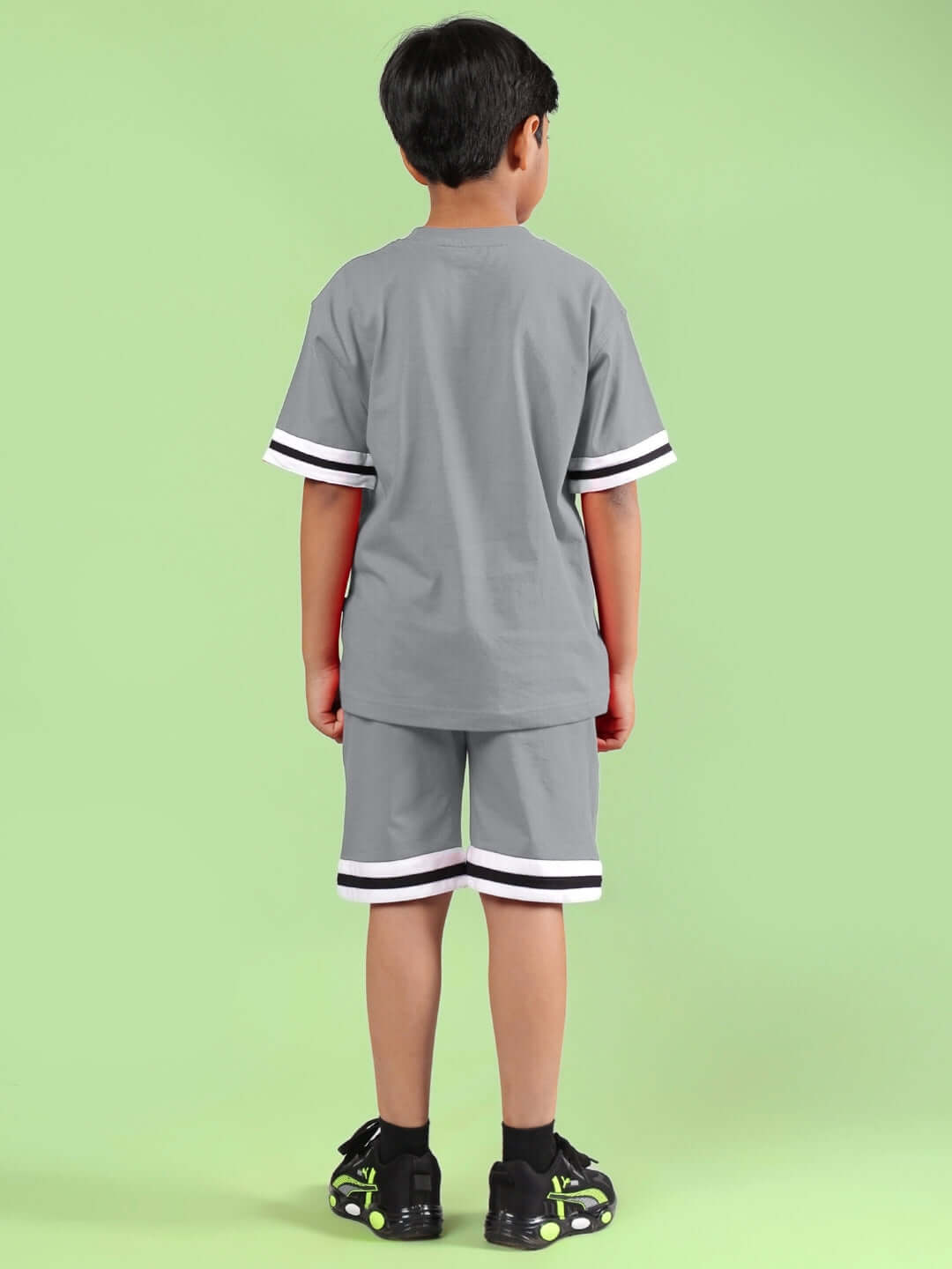 Child wearing grey co-ord set from LETS GO PLAY collection, back view, suitable for boys and girls, customizable fit options available.