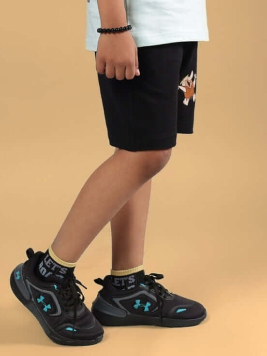 LET'S ROCK SHORTS FOR BOYS & GIRLS BLACK worn by child, side view, showing design and fit.