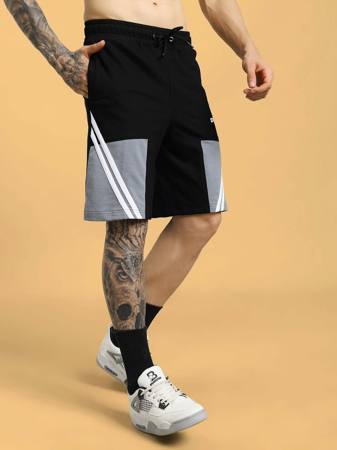 Man wearing LEWIN CHINO REGULAR FIT SHORTS BLACK-GREY, showcasing modern design, tailored fit, and premium cotton fabric.