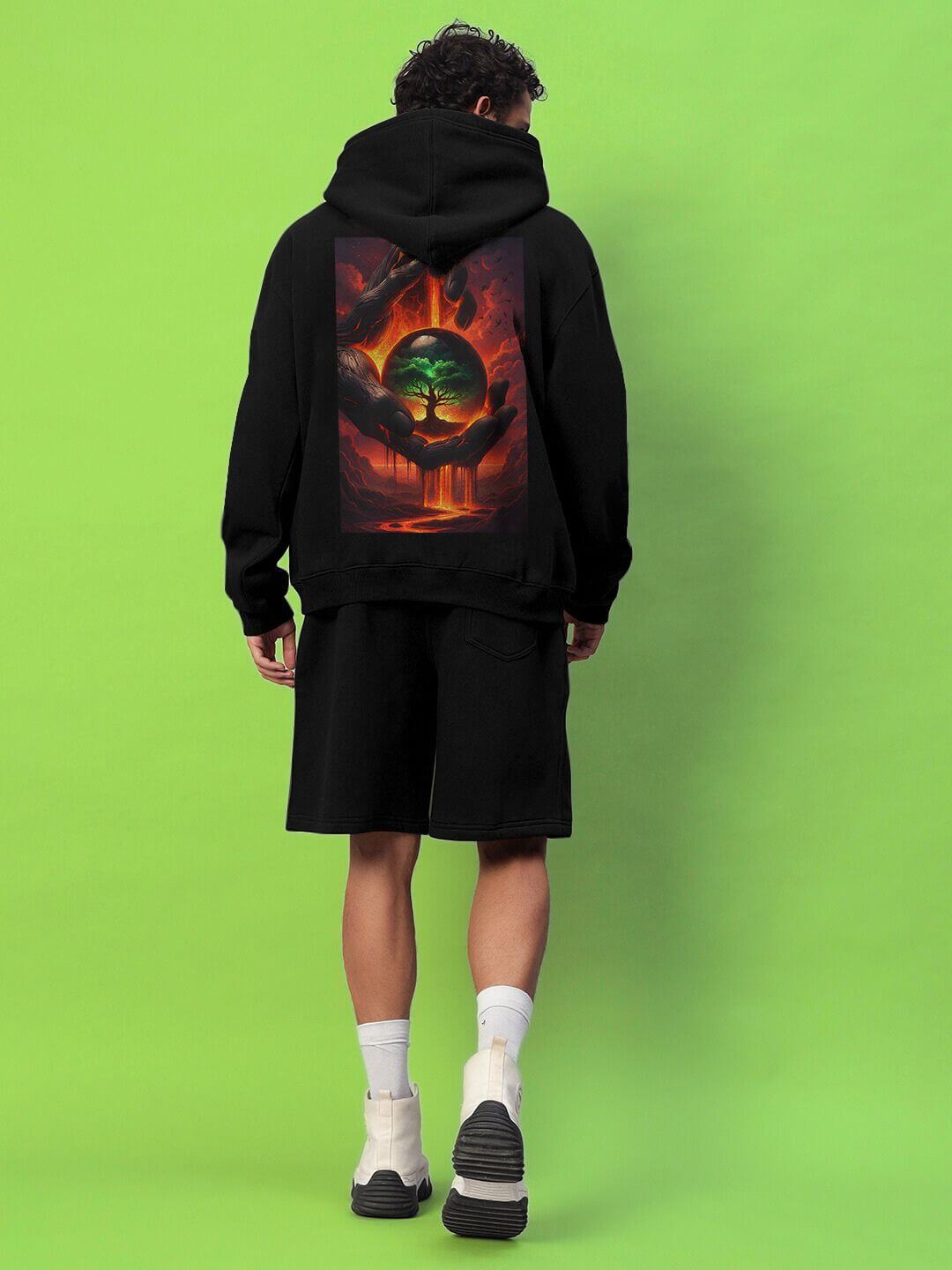 Model wearing LIFE IN THE CRUCIBLE PRINTED FLEECE CO-ORD BLACK with bold graphic print, showcasing streetwear style.