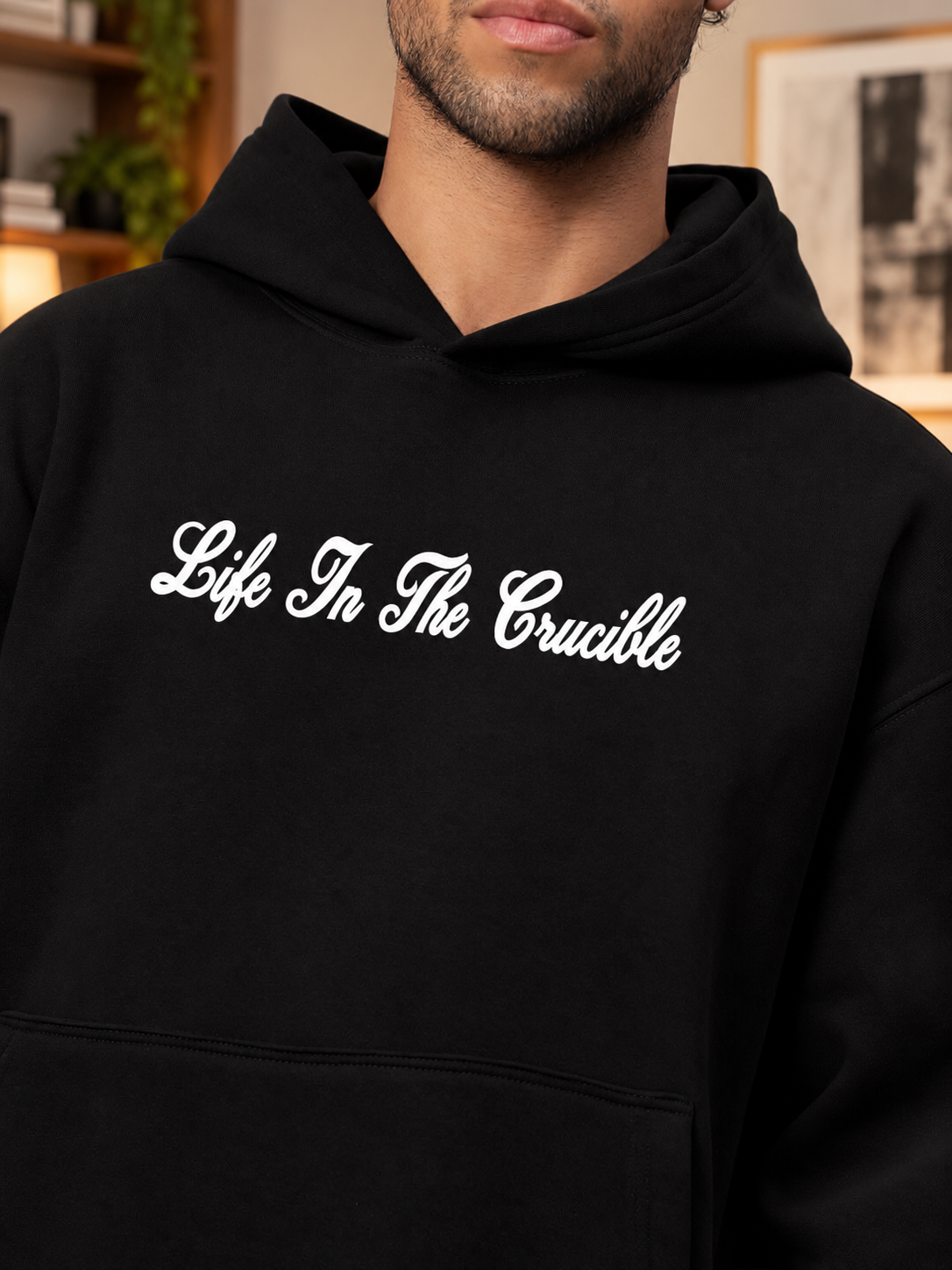 LIFE IN THE CRUCIBLE PRINTED FLEECE CO-ORD BLACK hoodie close-up with bold script print on soft black fabric