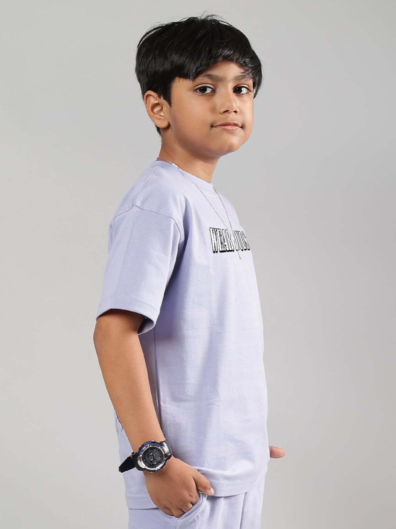 Boy wearing lilac Rapper Bunny T-shirt, side view, young fashion style for boys and girls.