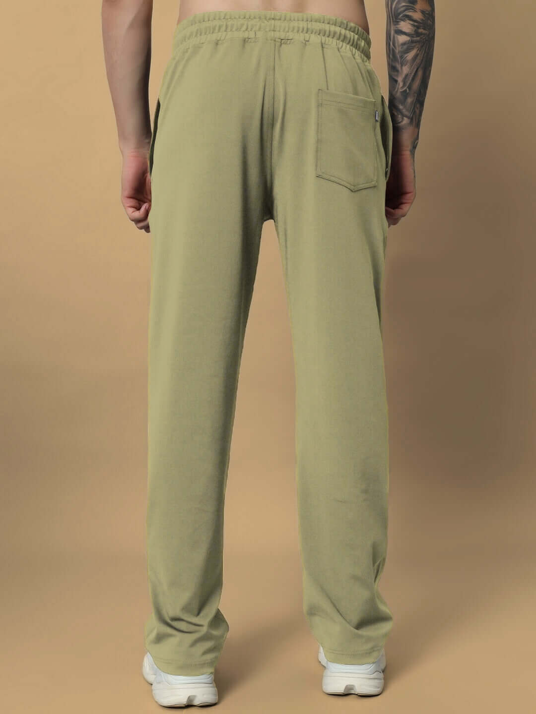 Back view of olive green LIMBER RELAXED PANT JOGGER, featuring an elastic waistband, single back pocket, and relaxed fit.