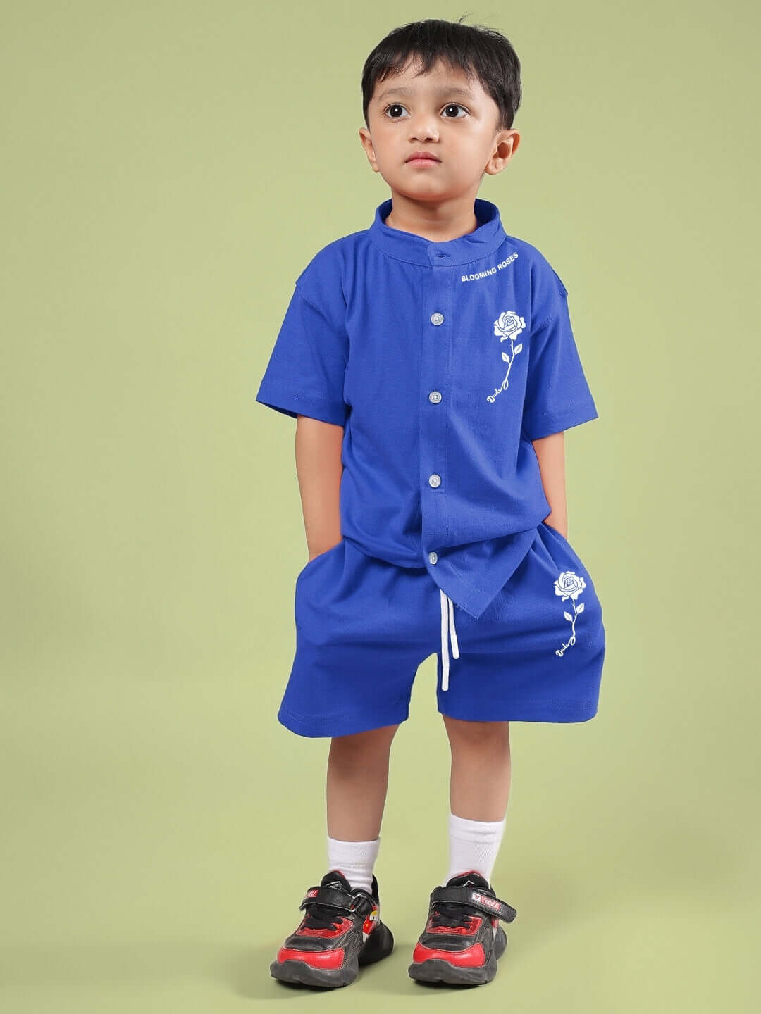 Child wearing LIMBO CO-ORD FOR BOYS & GIRLS BLUE featuring a blue shirt and shorts, perfect for comfort and style.