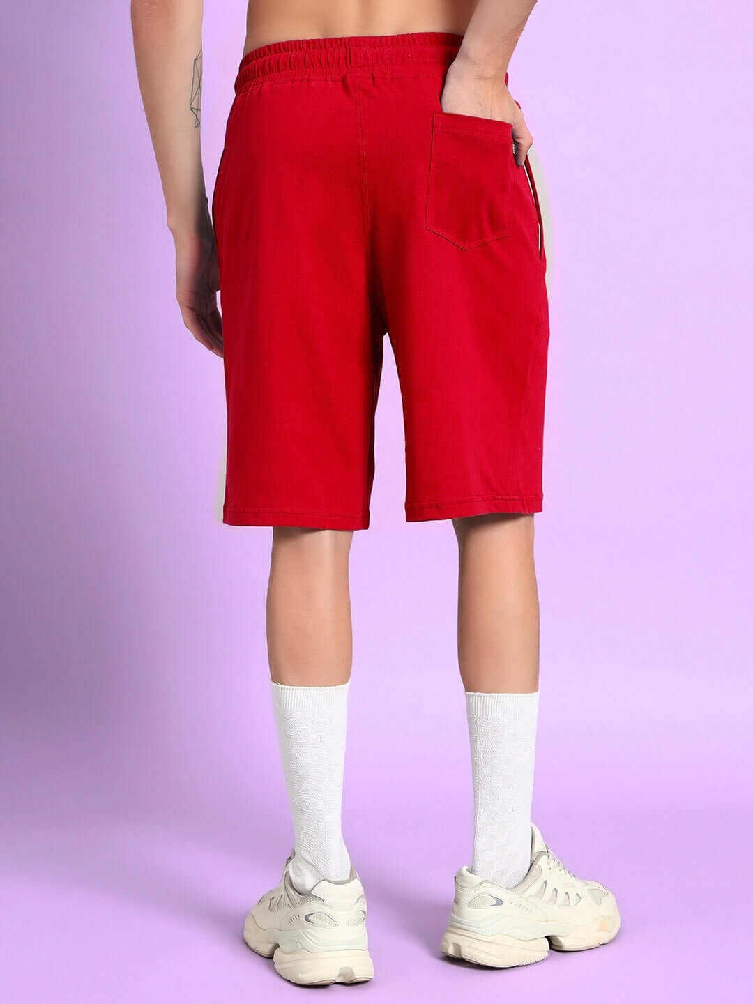 Back view of a person wearing red LIMBO CO-ORD SET shorts, made with premium cotton and elastane. Country of Origin: India.