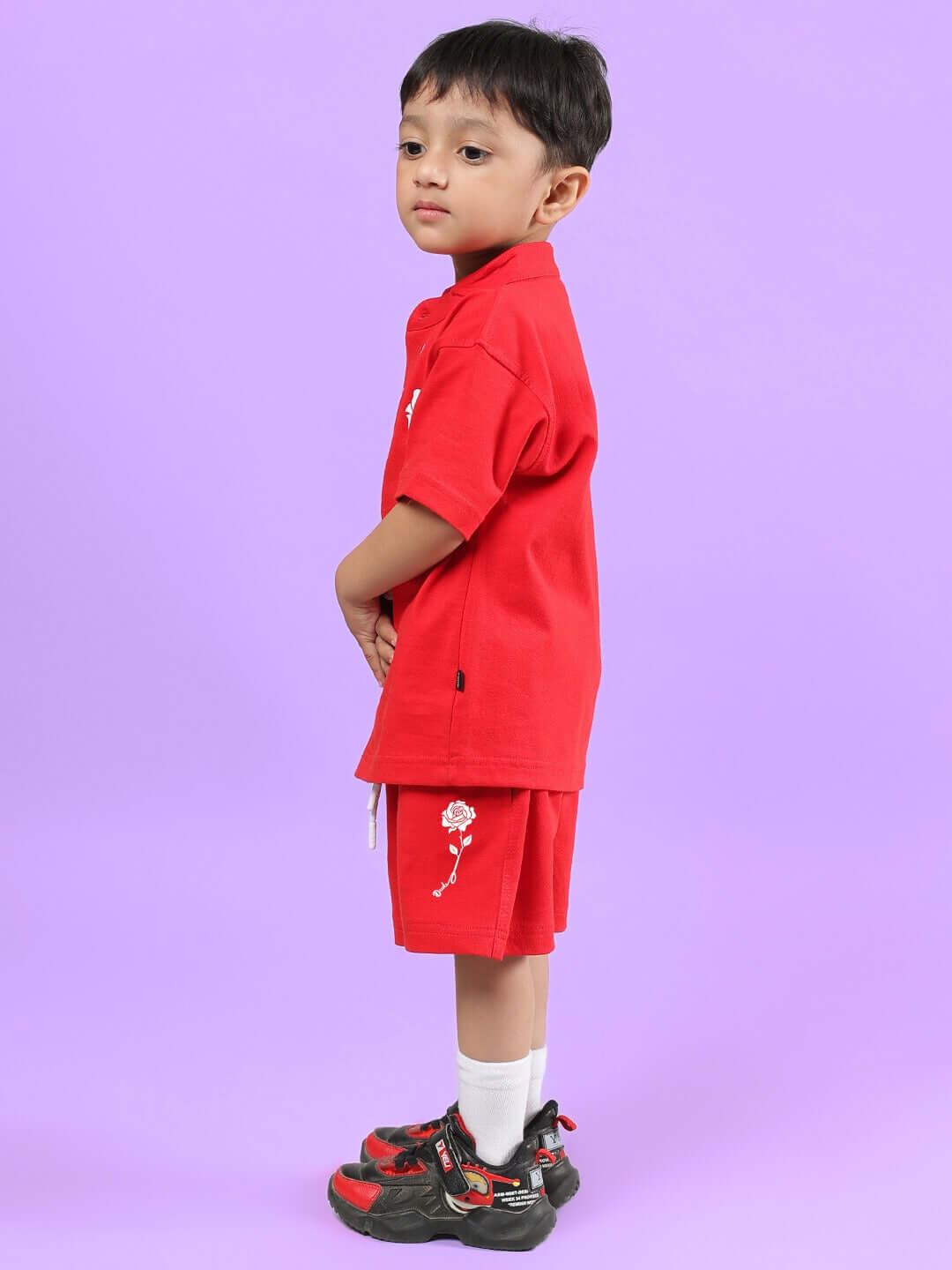 Boy wearing LIMBO CO-ORD FOR BOYS & GIRLS RED on a purple background