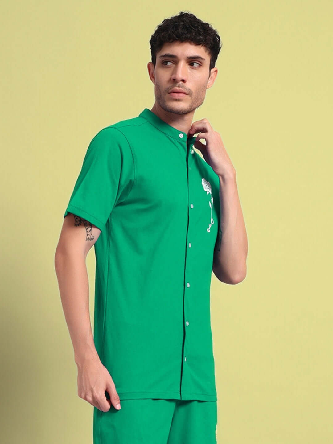 Man wearing a green LIMBO Regular Fit Shirt made of premium cotton French terry lycra, ideal for style and comfort.