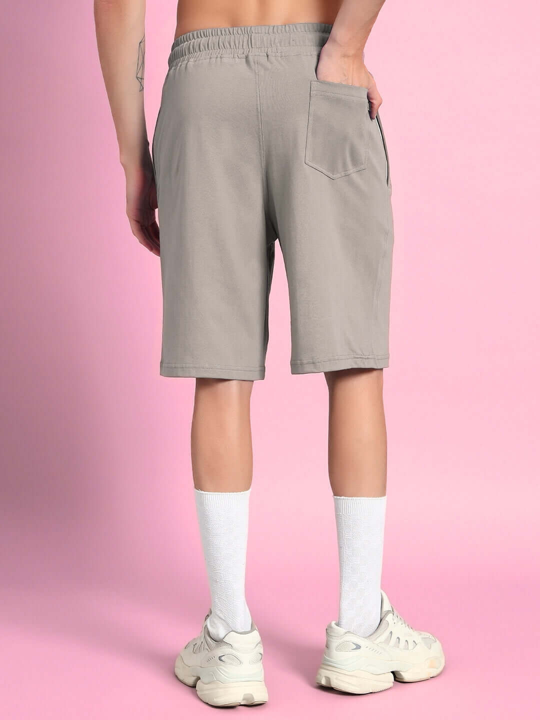 Back view of LIMBO grey co-ord shorts made of premium cotton French terry fabric, highlighting elastic waistband and pocket detail.