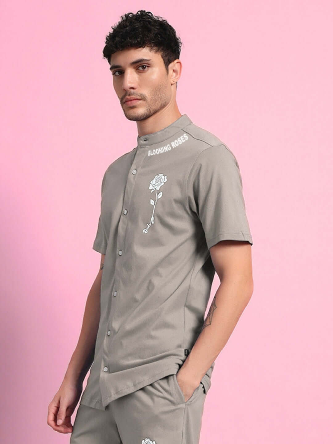 Man wearing LIMBO regular fit grey shirt with floral design, made of premium cotton blend. Fashionable, stylish, comfortable.