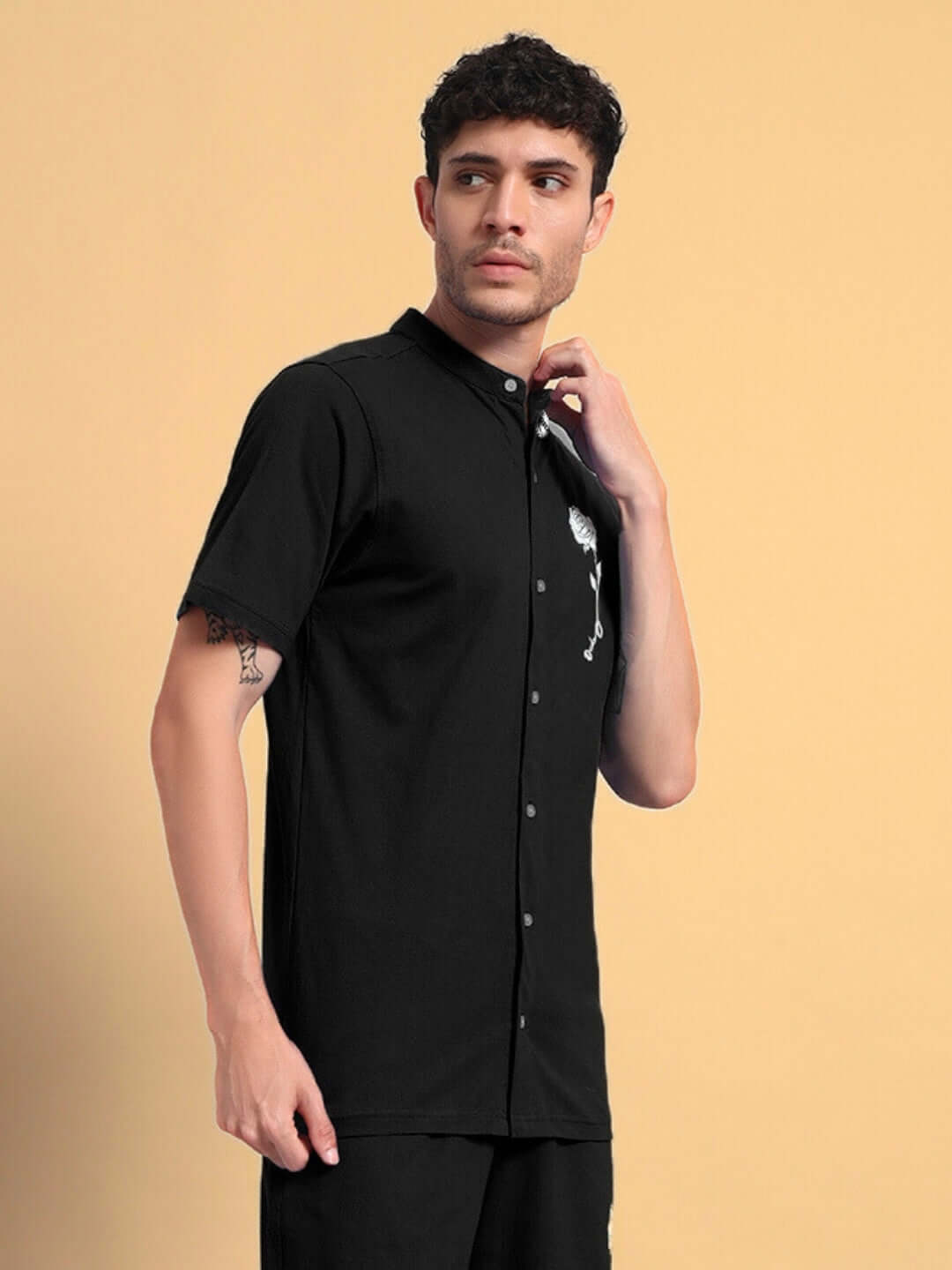 Model wearing the LIMBO Regular Fit Shirt in black, made from premium cotton French terry lycra, showcasing button-up design.