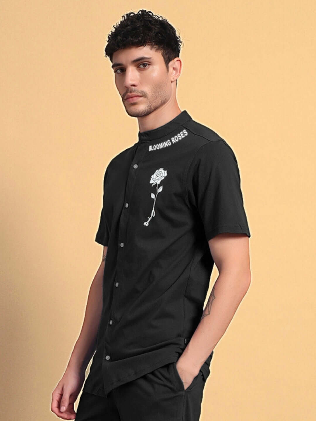 Man wearing LIMBO regular fit black shirt with floral embroidery, 97% premium cotton French terry lycra, stylish and comfortable.