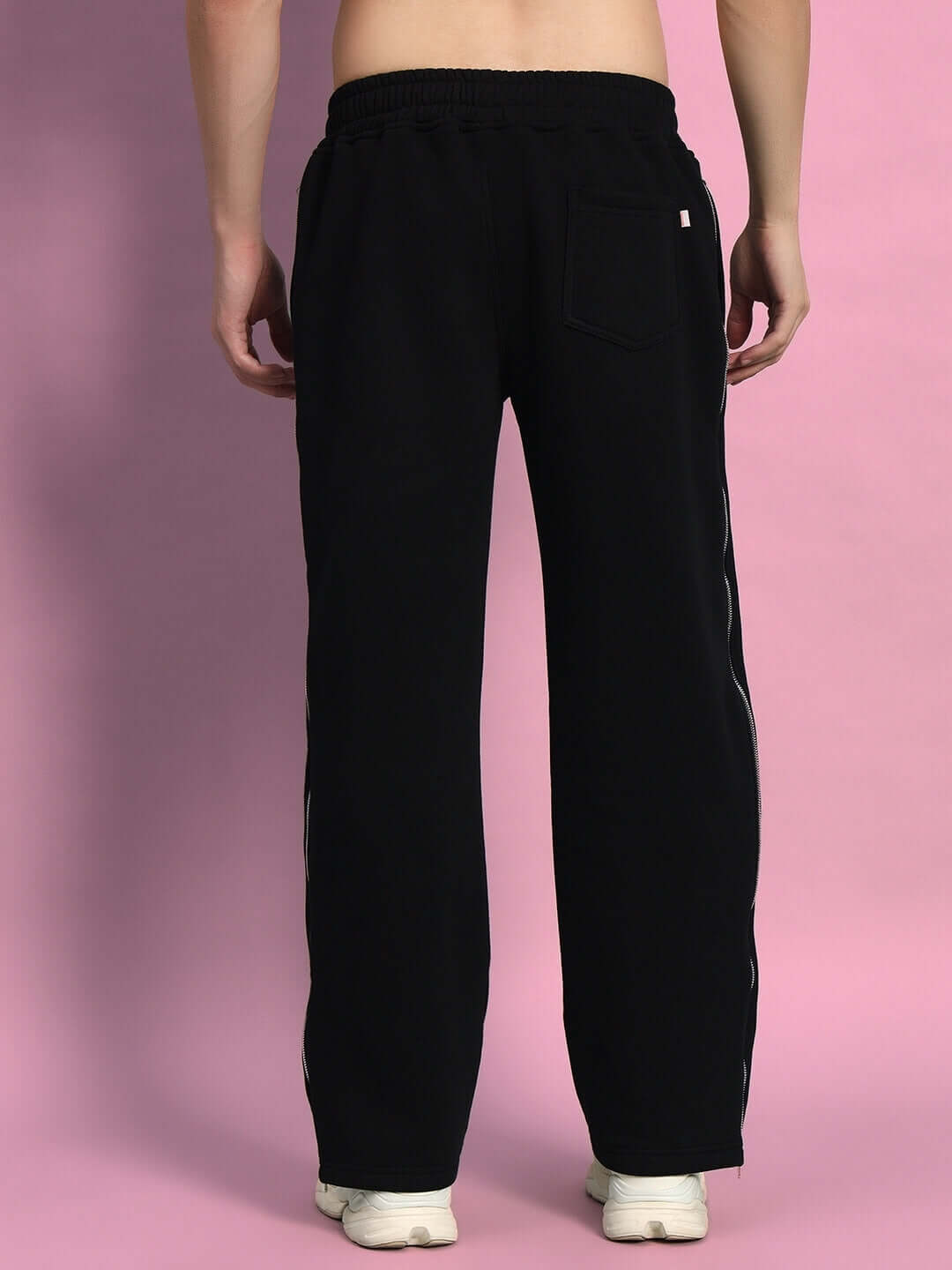 Back view of LIMITLESS FLEECE REFLECTOR JOGGER BLACK showcasing reflective detailing and tapered silhouette