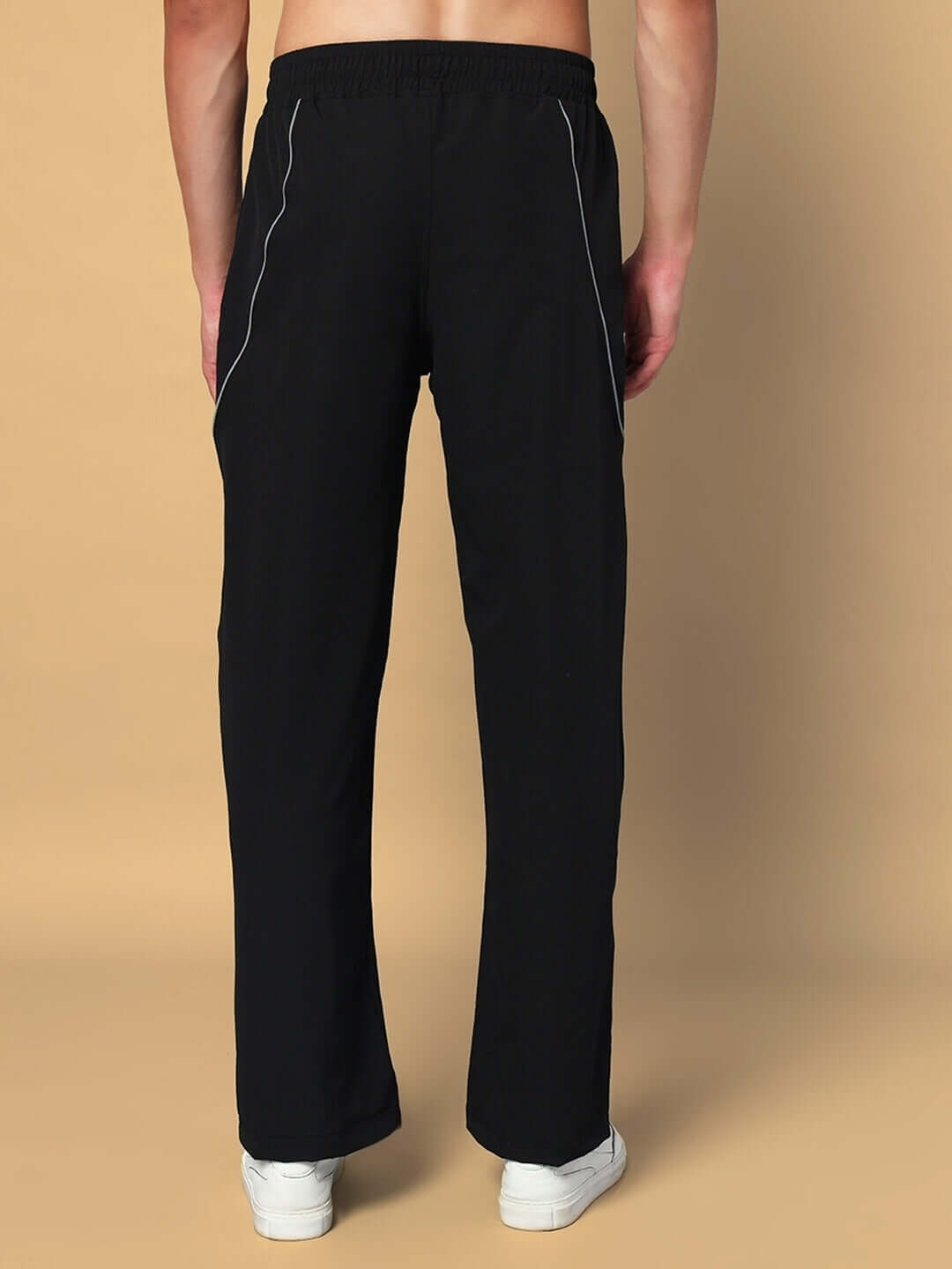 Back view of LOCO Reflector Parachute Cargo Pants in black, showcasing elastic waist and sleek design, ideal for custom fit options.