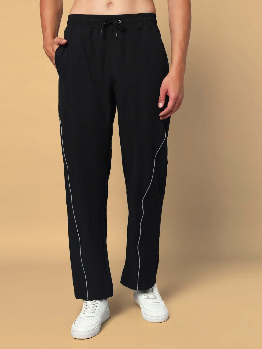 Man wearing black LOCO REFLECTOR PARACHUTE CARGO PANTS, showcasing custom fit option for prepaid orders, made by DUDS with care.