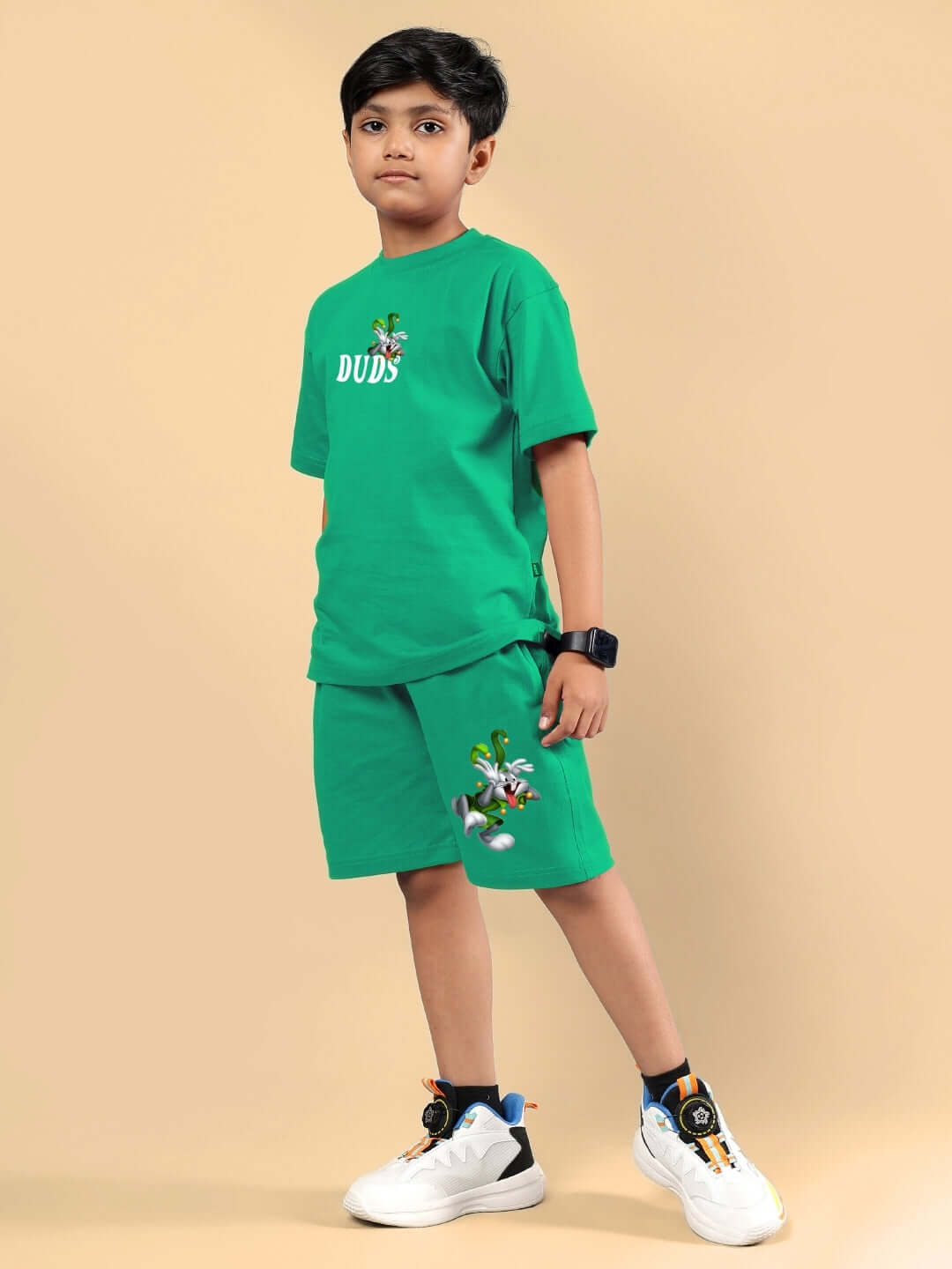 Boy wearing LOONEY TUNES PRINTED CO-ORD FOR BOYS & GIRLS GREEN outfit, featuring a playful design, perfect for casual wear.