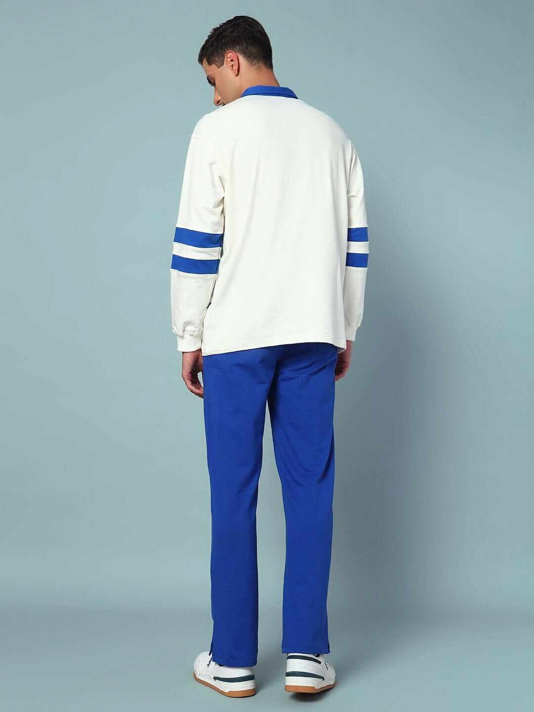 Model wearing LOVE DREAMS OVERSIZED CO-ORD SET with blue joggers and oversized top, showing back view for streetwear style.