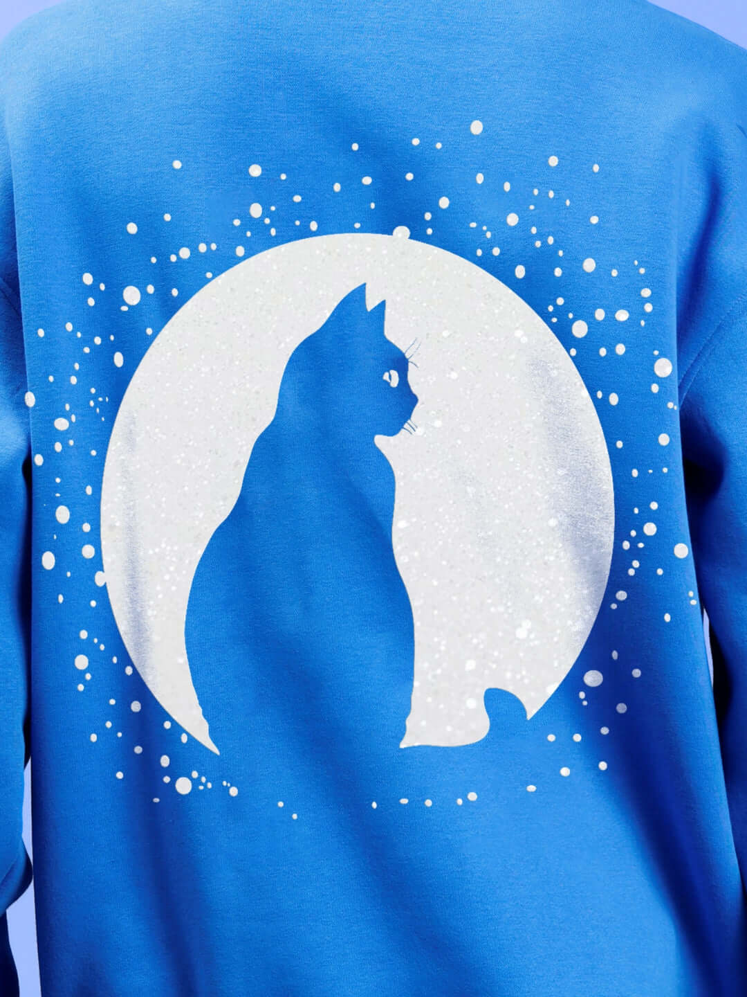 Back view of the LUNA FLECCE OVERSIZED HOODIE ROYAL BLUE featuring a cat silhouette design against a circular white background.