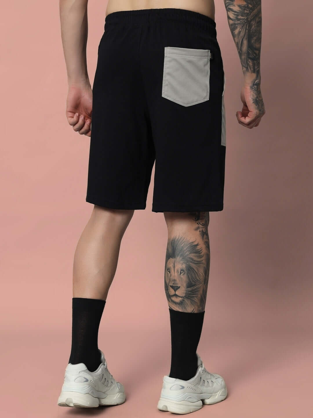 Model wearing black-grey Lustre Co-ord shorts with pocket, showcasing premium cotton French terry blend, ideal for casual wear.