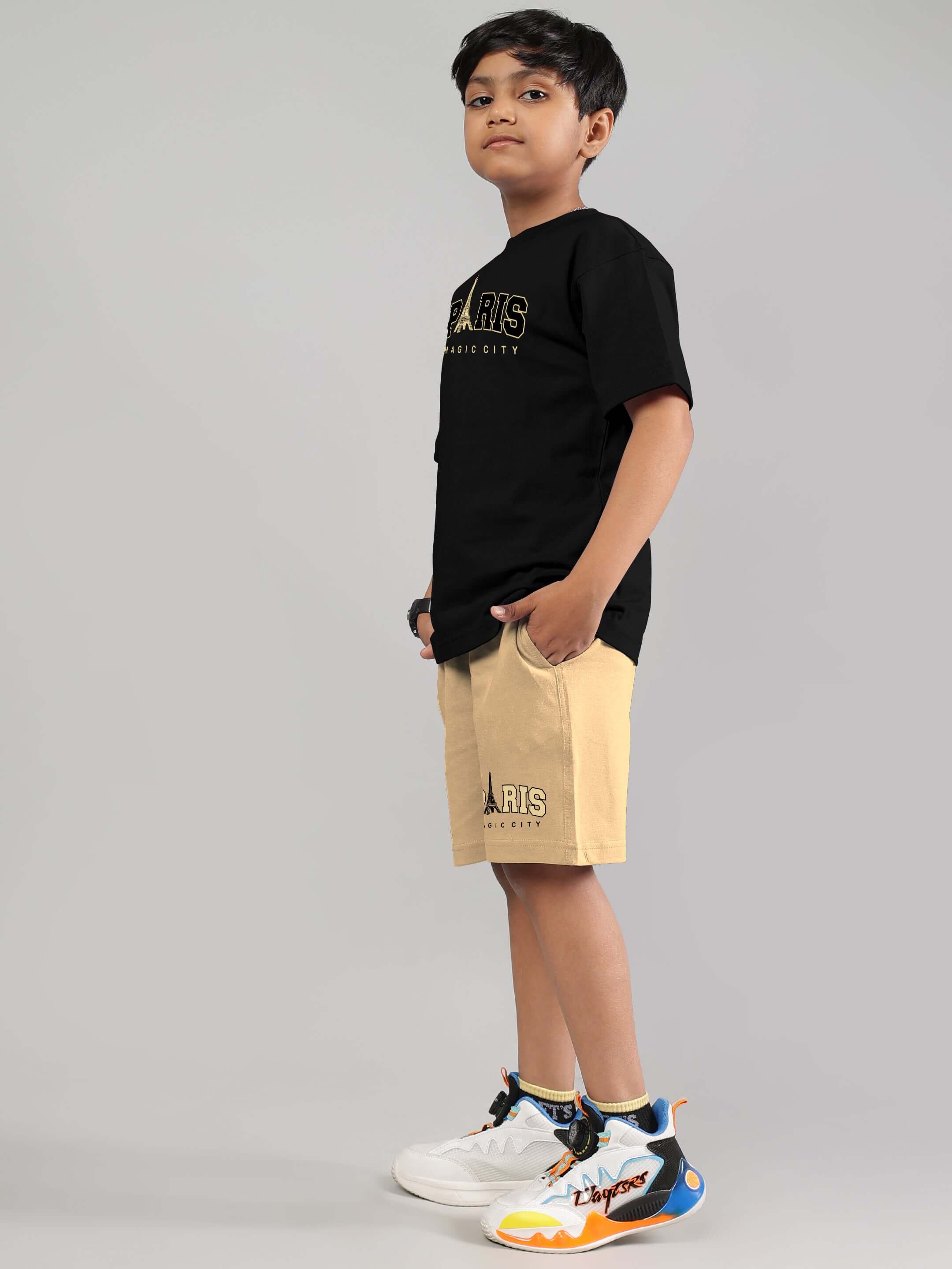 Boy wearing a black and beige Magic City co-ord set with sneakers, showcasing stylish and comfortable kids' fashion.