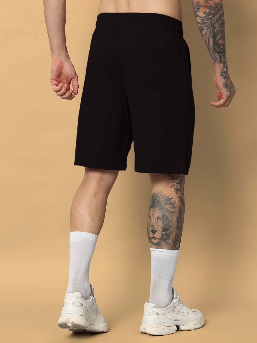 Back view of man wearing black Majestic Fish Regular Fit Shorts, showcasing customizable size option for optimal comfort and style.