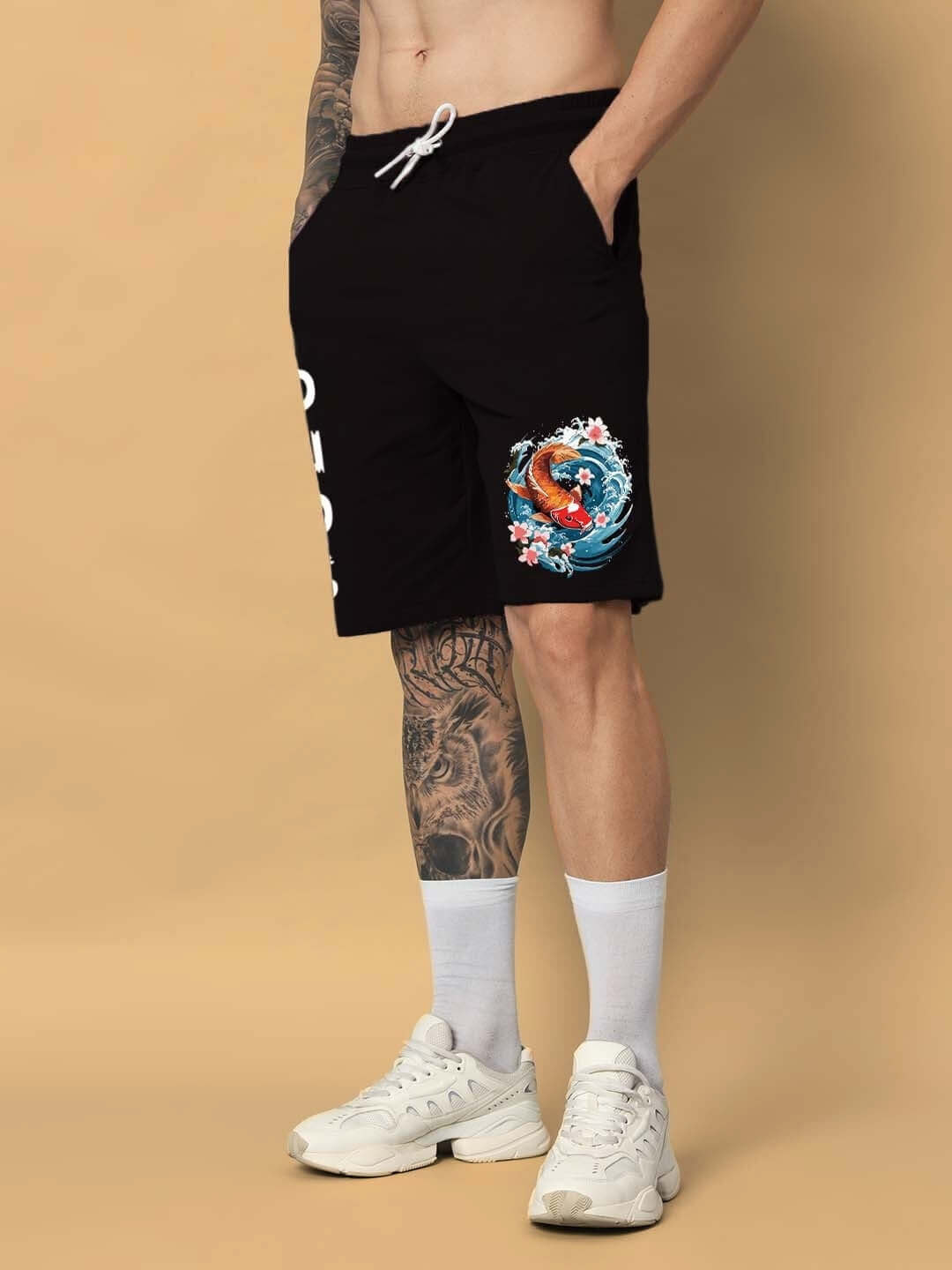 Person wearing black Majestic Fish Regular Fit Shorts with vibrant fish design; customizable size option available for prepaid orders.