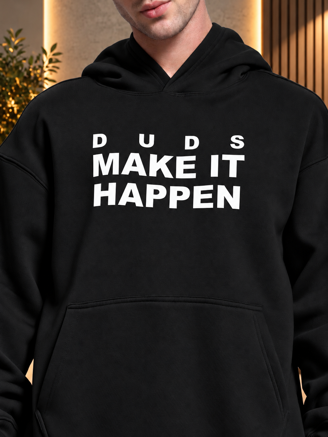 MAKE IT HAPPEN FLEECE HOODIE BLACK worn by man with DUDS graphic print, cozy streetwear style