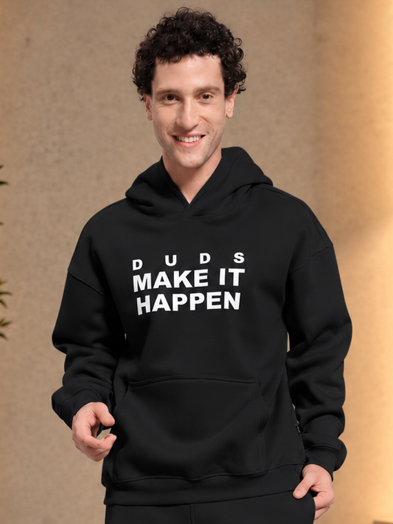 Man smiling wearing MAKE IT HAPPEN FLEECE HOODIE BLACK with DUDS logo print