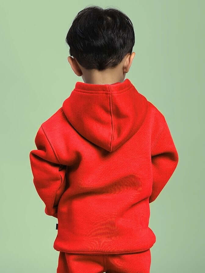Child wearing MAKE IT HAPPEN FLEECE HOODIE FOR BOYS AND GIRLS RED, showcasing vibrant color and cozy design for active kids.