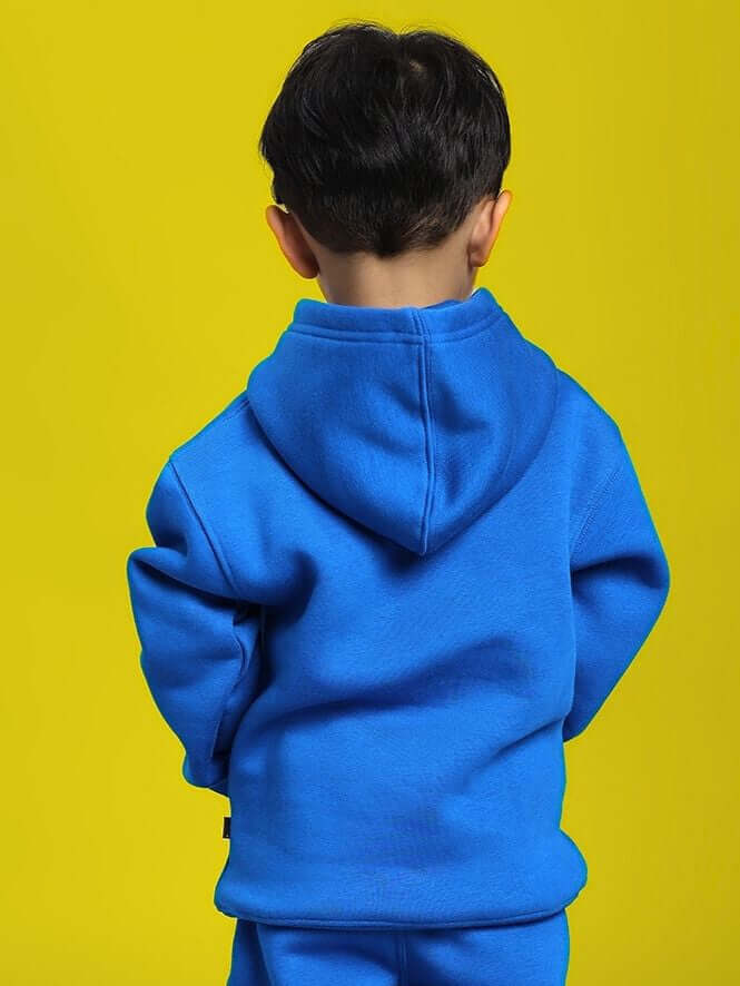 Child wearing MAKE IT HAPPEN FLEECE HOODIE FOR BOYS AND GIRLS ROYAL BLUE, rear view on yellow background.