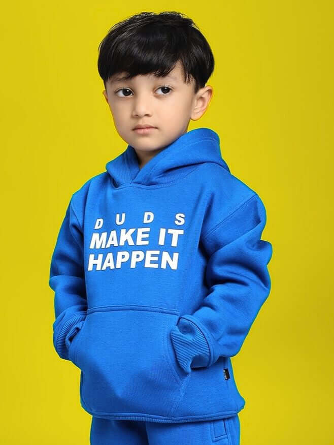 Young child wearing MAKE IT HAPPEN FLEECE HOODIE FOR BOYS AND GIRLS ROYAL BLUE, showcasing vibrant royal blue color on yellow background.