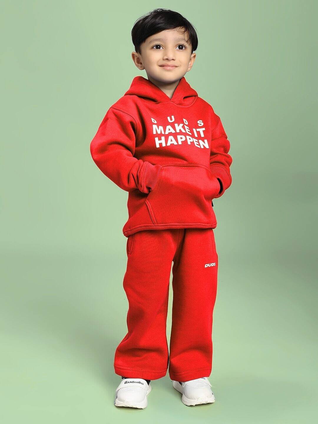 Child wearing MAKE IT HAPPEN FLEECE CO-ORD FOR BOYS AND GIRLS RED set, showcasing bold style and comfort in vibrant red for young trendsetters.