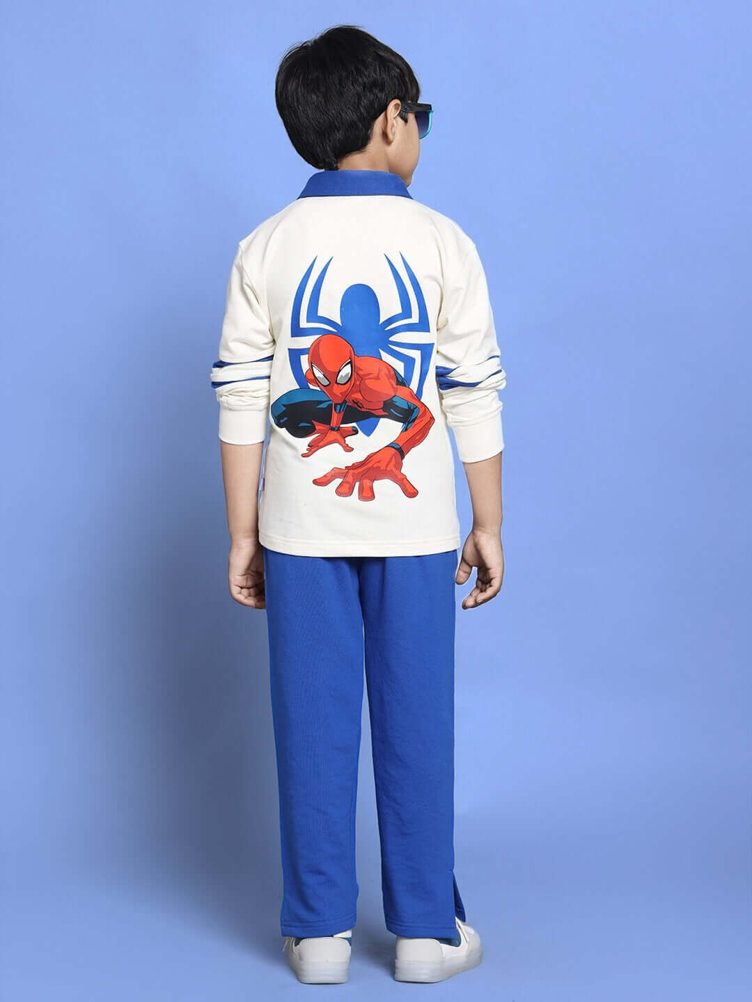 Child wearing Marvel white and royal blue co-ord set featuring Spider-Man design, relaxed fit joggers, elastic waistband.