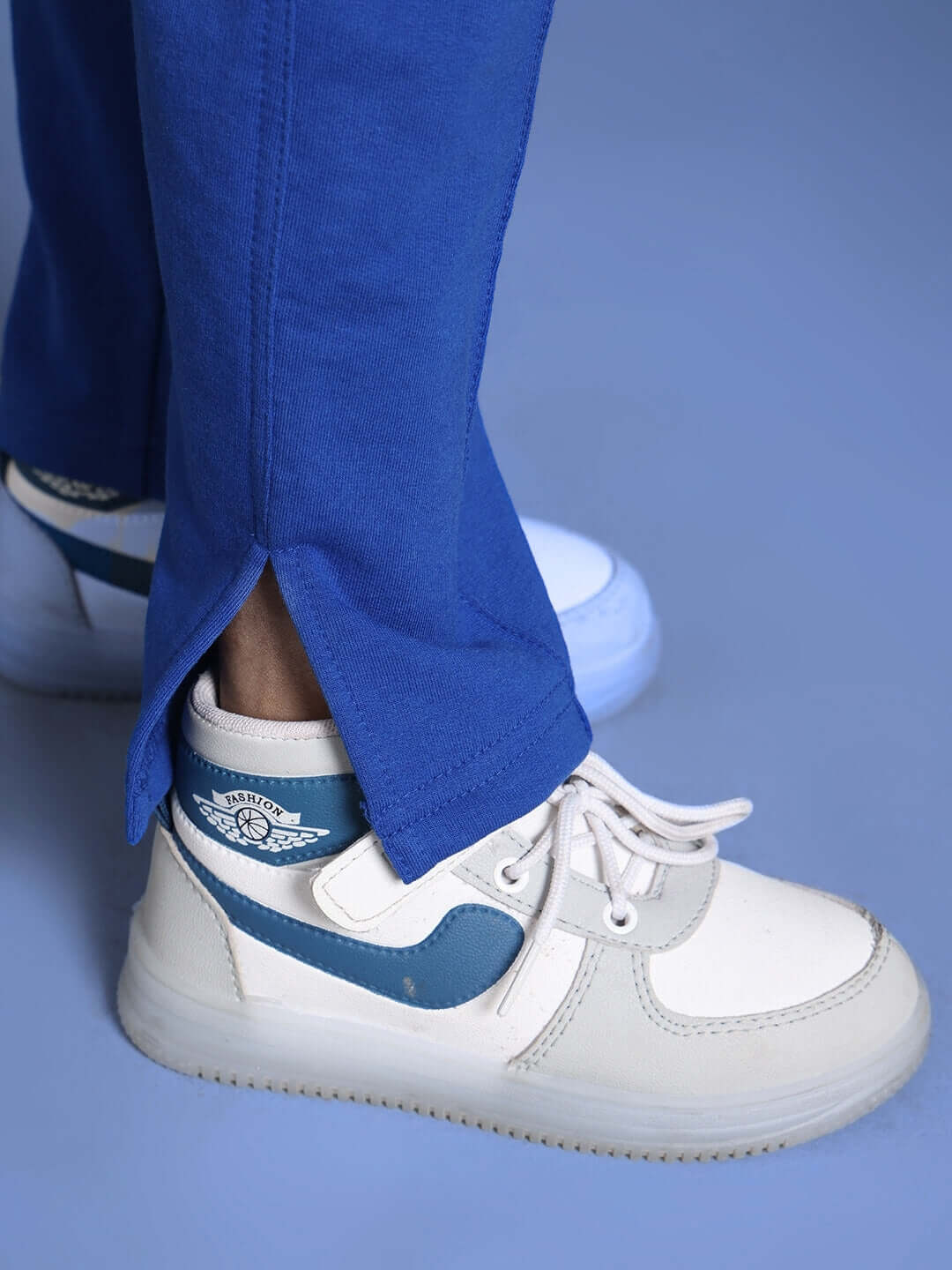 Close-up of royal blue joggers from the Marvel Co-Ord Set for boys & girls, featuring elasticated waistband and side slit detail.