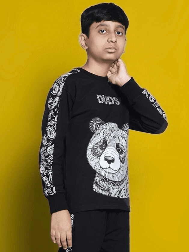 Boy wearing a black printed MASHA OVER-SIZED SWEATSHIRT FOR BOYS GIRLS BLACK.