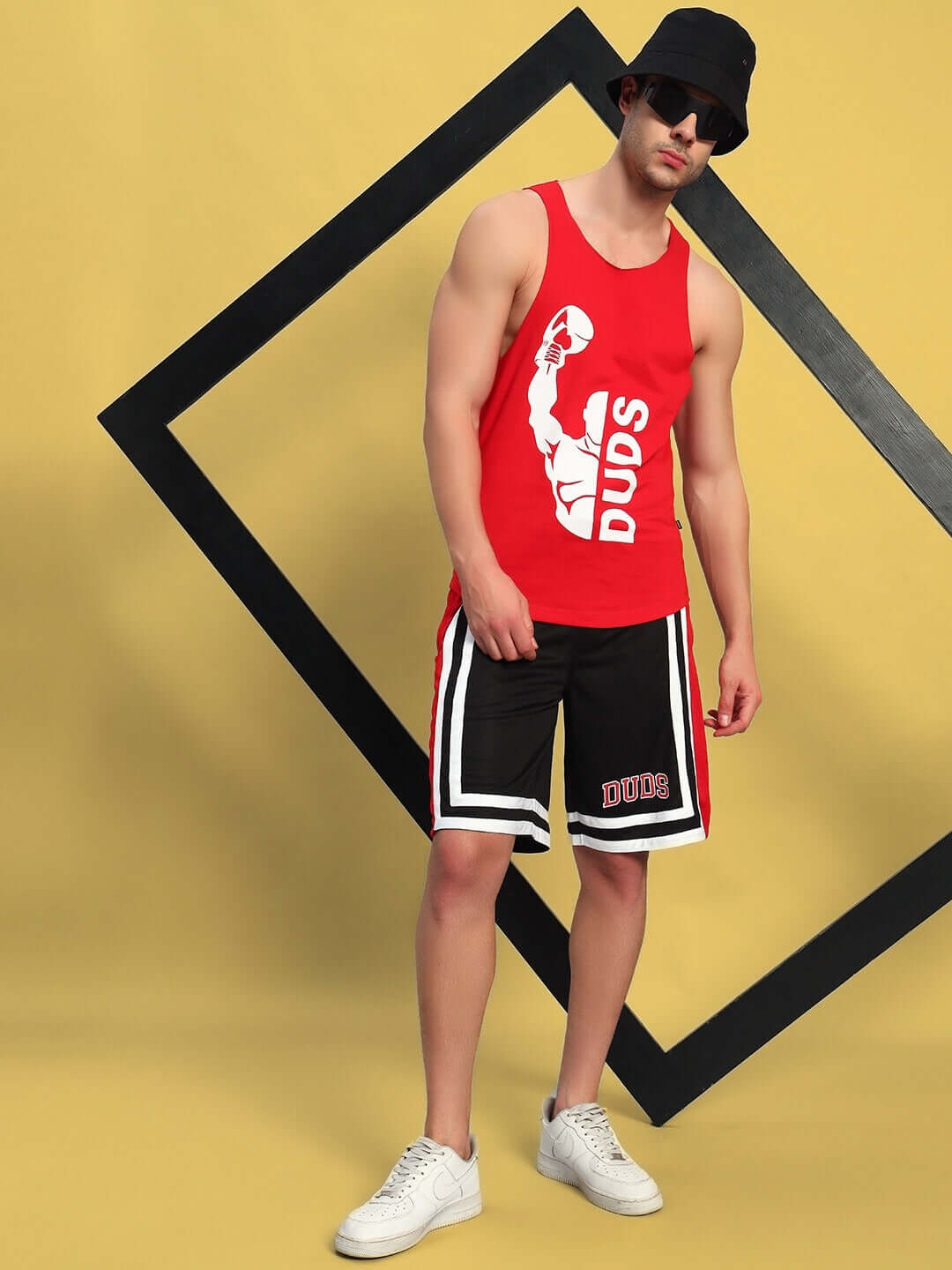 Max Gym Cotton Terry Co-Ord Set Red-Black on male model with sporty design against yellow geometric backdrop.