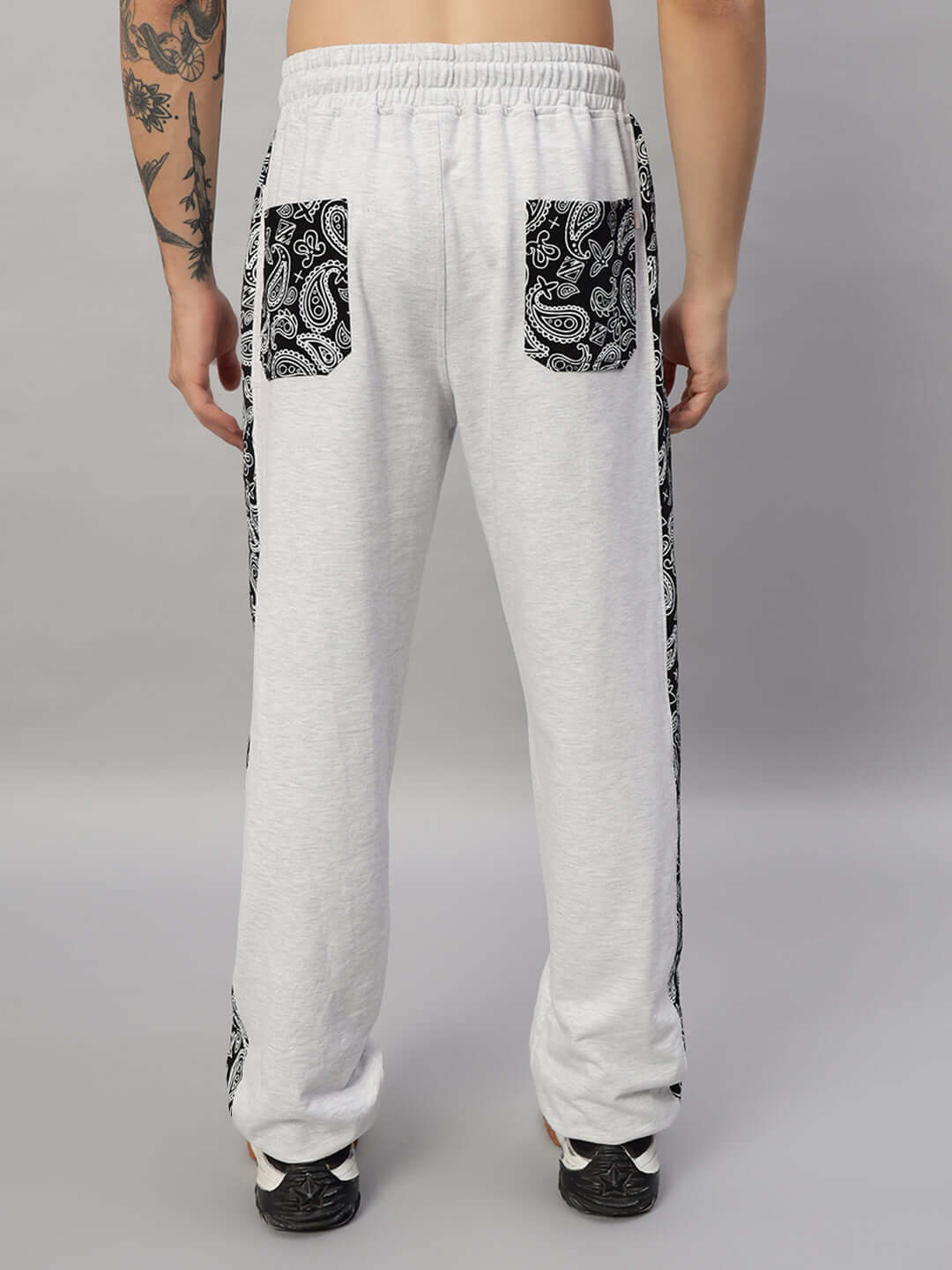 Back view of BOOGIE OVERSIZED CO-ORD SET MELANGE GREY showing relaxed fit pants with black paisley pocket detail.