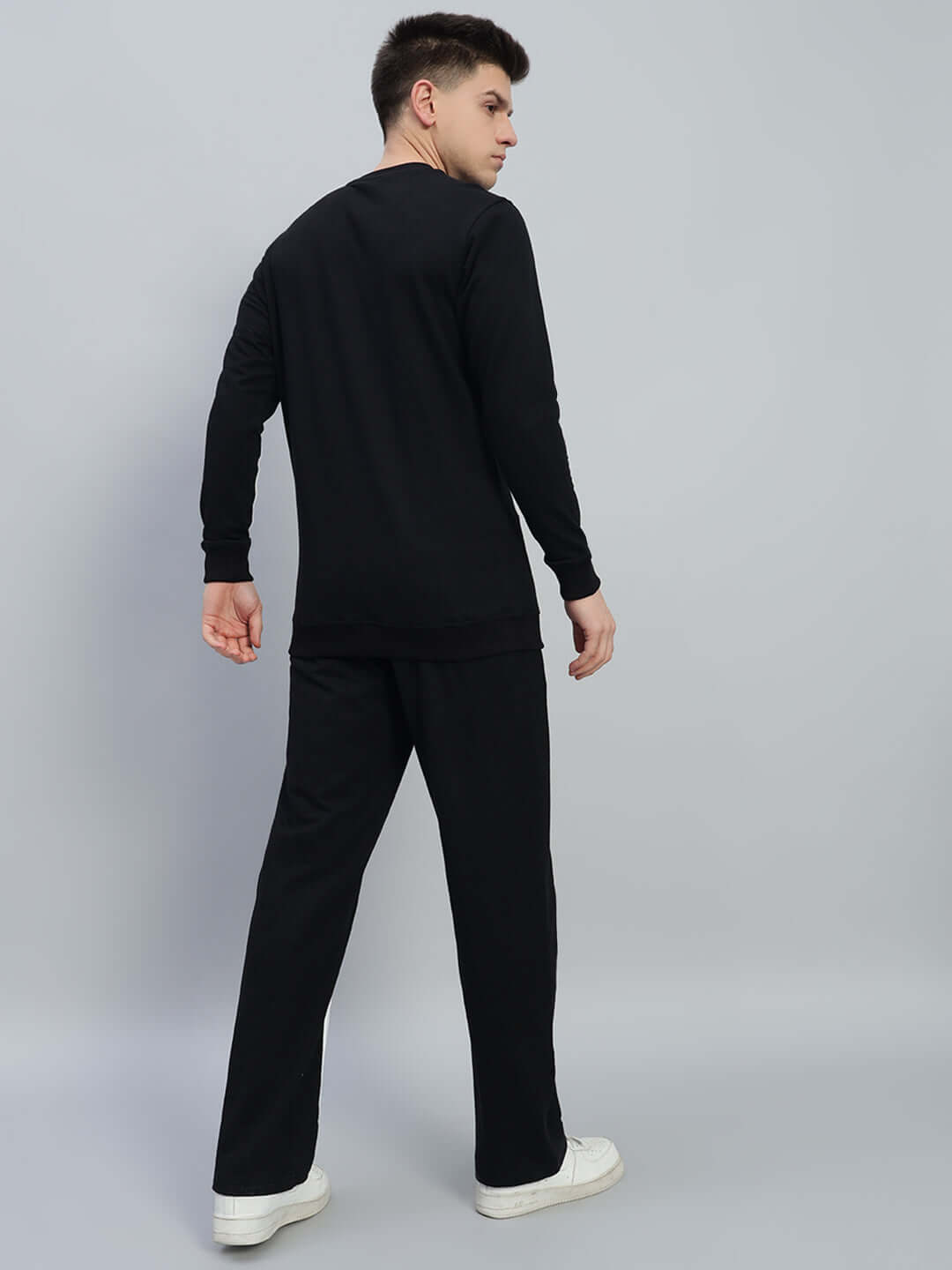 Model wearing Outlook Co-Ord Set in black, featuring unisex relaxed fit joggers with elastic waistband, made from premium cotton and elastane.
