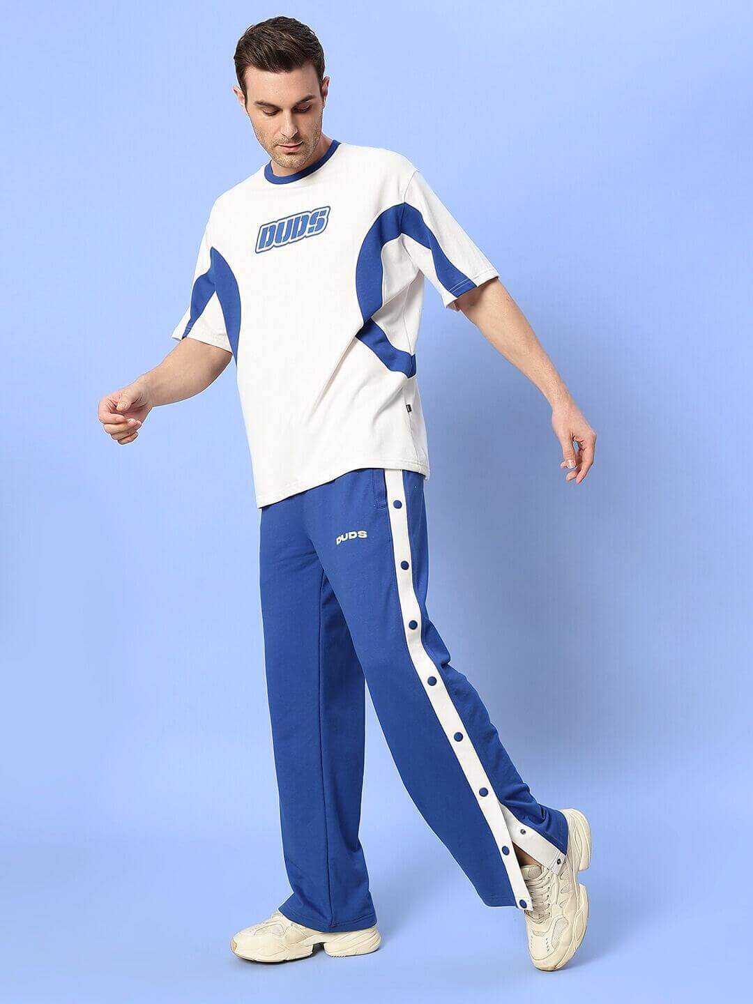 Model wearing EZEL Relaxed Fit Jogger in blue by DUDS, featuring a comfortable design perfect for casual wear.
