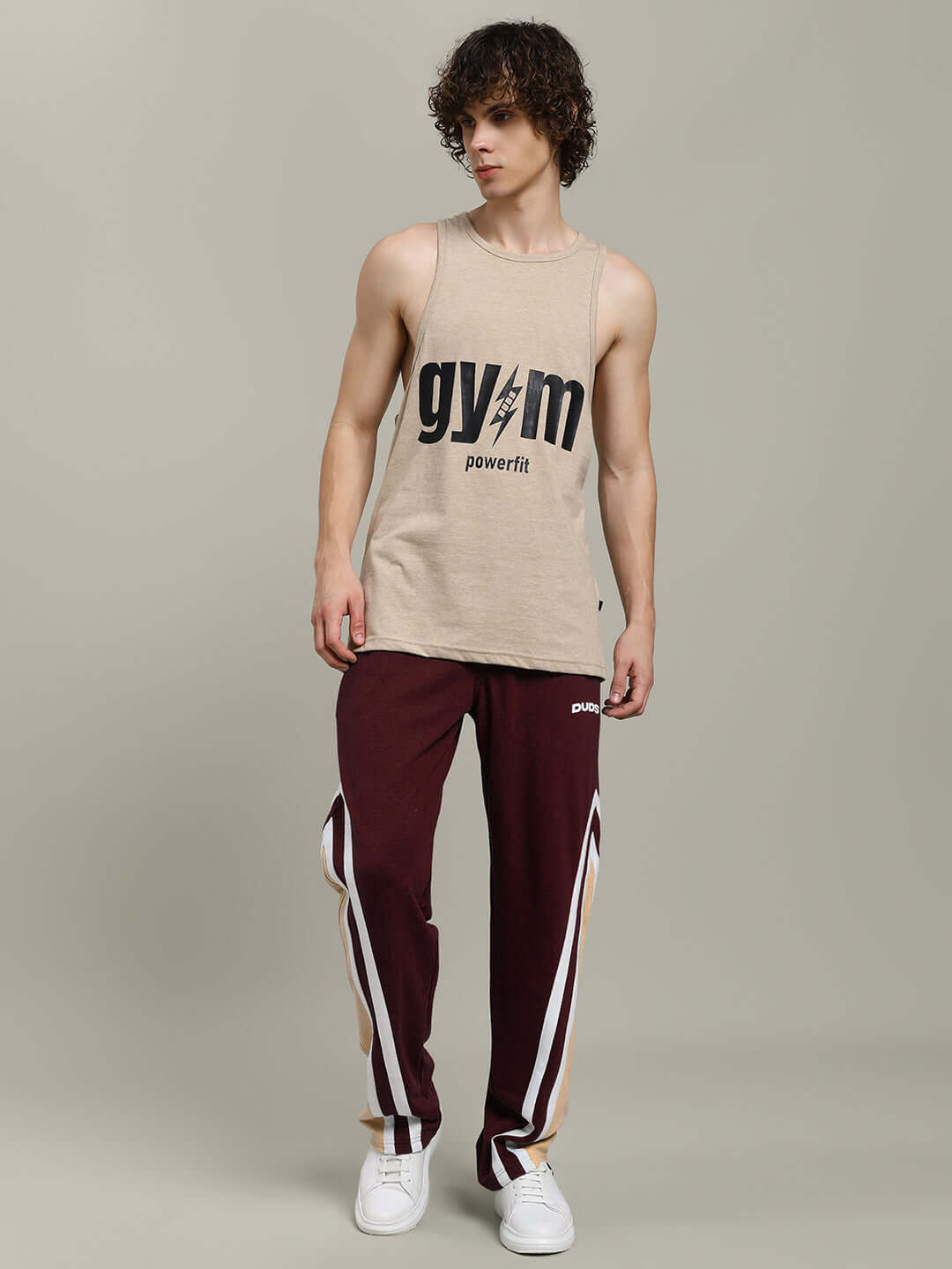 Model wearing RIO ONE Relaxed Fit Brown Joggers with customizable size option from DUDS.