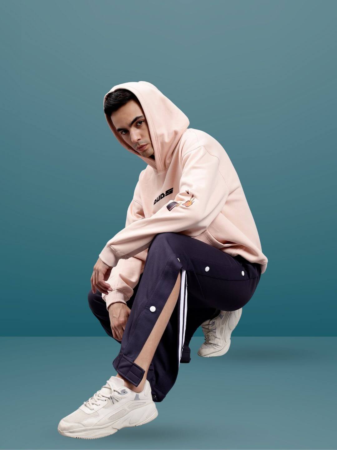 Model wearing HIP HOP JOGGERS in Dark Steel Grey paired with a hoodie and sneakers, showcasing urban fashion style.
