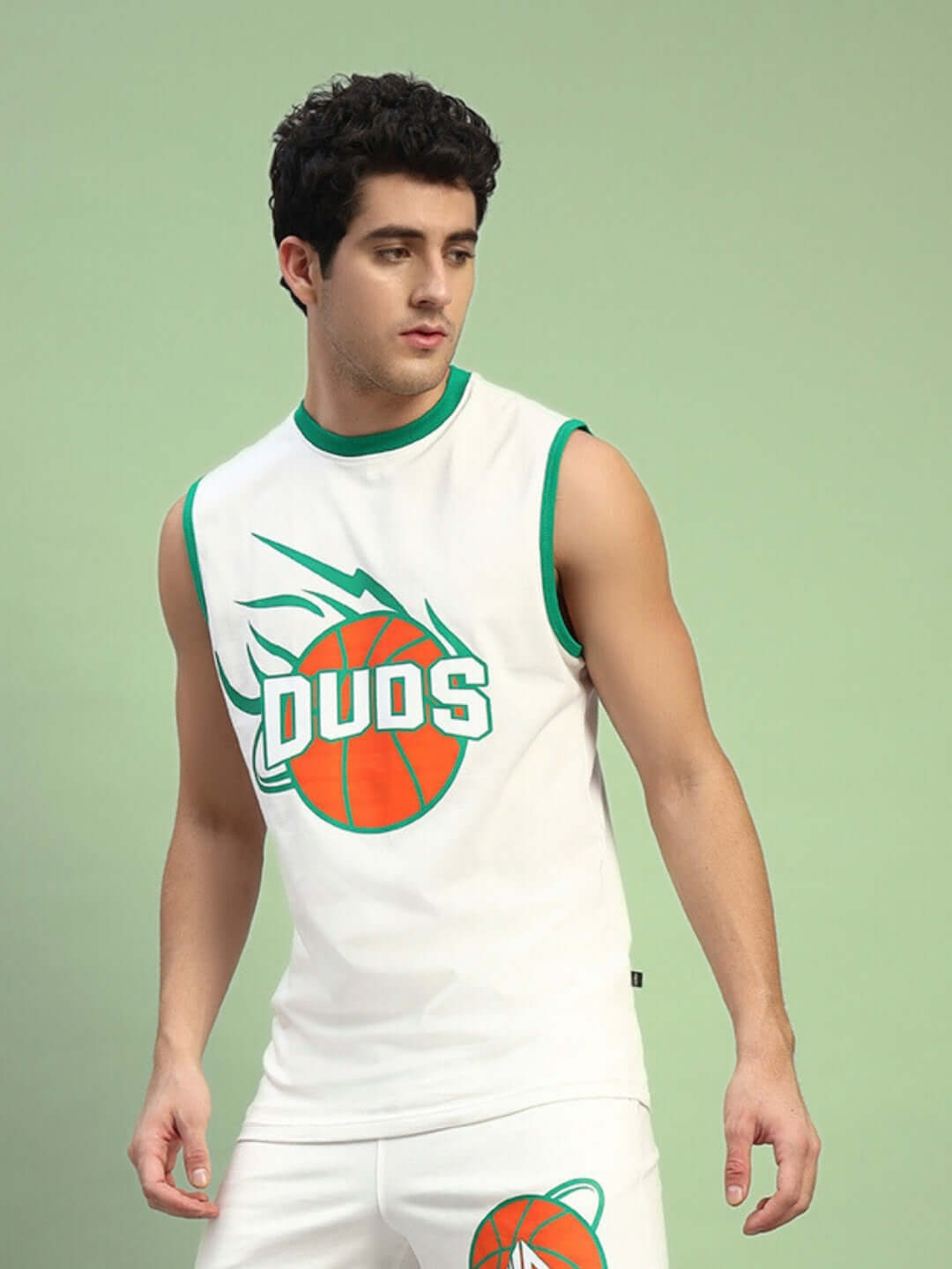 Sleeveless white DUDS sports shirt with orange basketball graphic.
