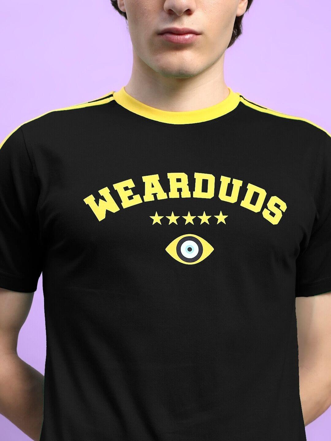 Person wearing black t-shirt with "Wearduds" print and eye graphic on chest. IRISH REGULAR FIT T-SHIRT BLACK
