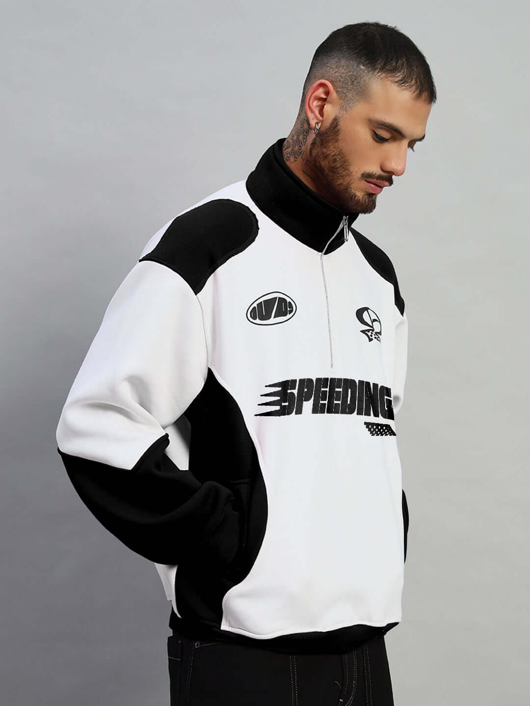 Man wearing a black and white SPEEDING colorblock jacket with custom fit option by DUDS, made to order by experienced tailors.
