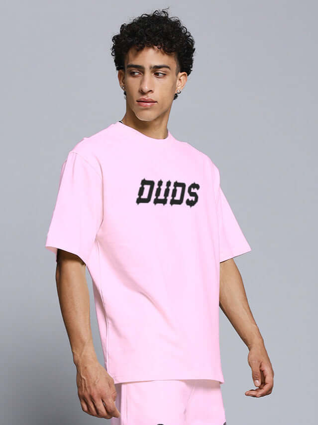 Model wearing MESSI Paisley Print oversized pink T-shirt made of premium cotton French terry with elastane, 240 GSM, bio-washed.