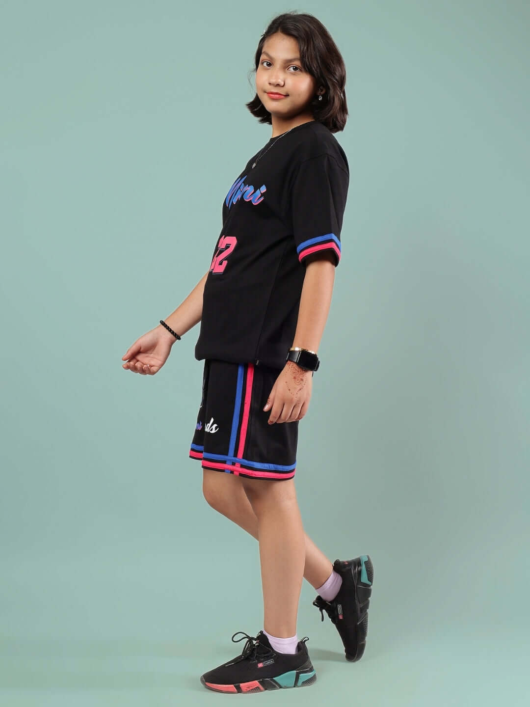 Young person wearing MIAMI CO-ORD FOR BOYS & GIRLS BLACK outfit, showcasing trendy design suitable for all kids.